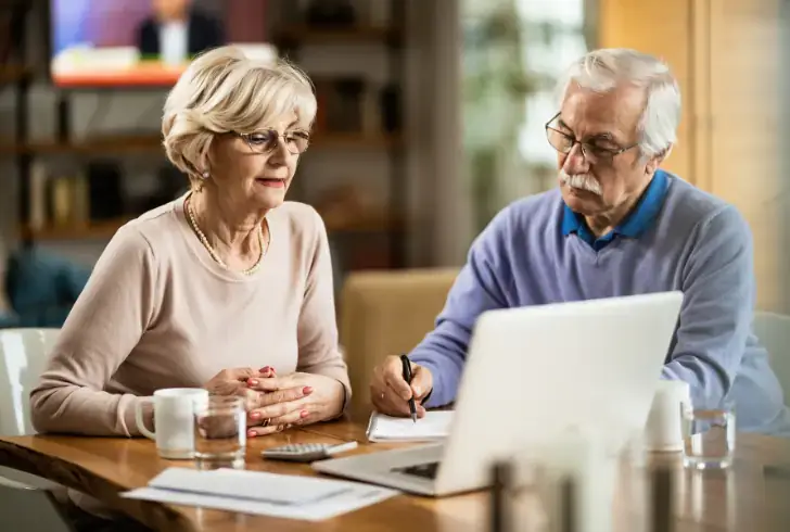 Senior couple reviews Medigap insurance plans